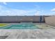 Inviting backyard includes a pool with a waterfall and sun umbrella at 11357 E Unger Ave, Mesa, AZ 85212