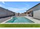 Relaxing backyard with a beautiful pool featuring a waterfall and an umbrella at 11357 E Unger Ave, Mesa, AZ 85212