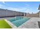 Backyard pool features a waterfall feature, lush turf, and great privacy at 11357 E Unger Ave, Mesa, AZ 85212