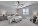 Serene bedroom with a king-sized bed, tufted headboard, and side tables with lamps at 11357 E Unger Ave, Mesa, AZ 85212