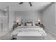 Bright bedroom with a comfortable bed, soft lighting, and neutral decor at 11357 E Unger Ave, Mesa, AZ 85212