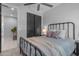 Bright bedroom featuring a comfortable bed, modern ceiling fan, and ample closet space for organized living at 11357 E Unger Ave, Mesa, AZ 85212