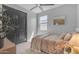 Bright bedroom with plush carpet, comfortable bed, and ample sunlight, creating a cozy and inviting space at 11357 E Unger Ave, Mesa, AZ 85212