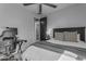 Bright bedroom featuring comfortable bed, ceiling fan, and desk with natural light at 11357 E Unger Ave, Mesa, AZ 85212