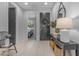 Elegant entryway featuring a dark front door, console table, and modern decor at 11357 E Unger Ave, Mesa, AZ 85212