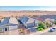 Exterior shot of a well-maintained single-Gathering home with a paved driveway and desert landscaping at 11357 E Unger Ave, Mesa, AZ 85212