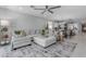 Spacious living room featuring a comfortable sectional sofa, stylish rug, and an open concept design at 11357 E Unger Ave, Mesa, AZ 85212