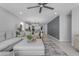 Spacious living room with comfortable sectional sofa, ceiling fan, and open layout at 11357 E Unger Ave, Mesa, AZ 85212