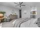 Relaxing main bedroom featuring neutral tones, a soft throw blanket, and decorative touches at 11357 E Unger Ave, Mesa, AZ 85212