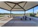 Well-maintained picnic area with shaded tables offers a relaxing outdoor community gathering space at 11357 E Unger Ave, Mesa, AZ 85212