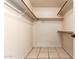 Empty walk-in closet with tile floors, multiple racks and closet rod at 14216 N Saguaro Blvd # A, Fountain Hills, AZ 85268
