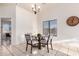 Bright dining area featuring tiled floors, a round table with four chairs, and a window view at 14216 N Saguaro Blvd # A, Fountain Hills, AZ 85268