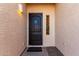 Inviting front entryway features a dark wood door, welcome sign, and stylish exterior lighting at 14216 N Saguaro Blvd # A, Fountain Hills, AZ 85268