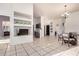 Spacious room with tiled floors, built-in shelving, and an open layout seamlessly connecting to the dining area at 14216 N Saguaro Blvd # A, Fountain Hills, AZ 85268