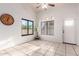Bright living room with large windows, tiled floors, and neutral walls, creating a spacious feel at 14216 N Saguaro Blvd # A, Fountain Hills, AZ 85268