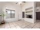 Open-concept room featuring tiled floors, built in shelving, and views of kitchen and living areas at 14216 N Saguaro Blvd # A, Fountain Hills, AZ 85268