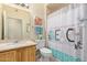Well-maintained bathroom with sink, toilet, vanity, and shower/tub combo featuring themed curtain at 14950 W Mountain View Blvd # 1112, Surprise, AZ 85374