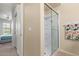 Bathroom shower with sliding glass door and modern fixtures, offering convenience and style at 14950 W Mountain View Blvd # 1112, Surprise, AZ 85374