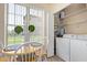 Laundry room with a washer, dryer, and storage space, adjacent to the breakfast nook at 14950 W Mountain View Blvd # 1112, Surprise, AZ 85374