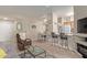 Cozy living room with a fireplace, breakfast bar, and comfortable seating at 14950 W Mountain View Blvd # 1112, Surprise, AZ 85374