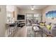 Relax in this charming living room with comfortable seating and access to the outdoor patio at 14950 W Mountain View Blvd # 1112, Surprise, AZ 85374