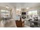 Open floor plan with living room, kitchen, dining, and patio access at 14950 W Mountain View Blvd # 1112, Surprise, AZ 85374