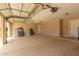Garage featuring an automatic door, storage, and plenty of open space at 1590 W Desert Broom Dr, Chandler, AZ 85248