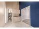 Hallway view featuring built-in cabinetry and doorway views of a bathroom and bedroom at 1590 W Desert Broom Dr, Chandler, AZ 85248