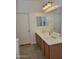 Stylish bathroom boasting double sinks, vanity and large mirror near a doorway at 15951 W Yavapai St, Goodyear, AZ 85338