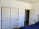Bright bedroom features large closet and ensuite bathroom entrance at 15951 W Yavapai St, Goodyear, AZ 85338