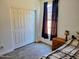 This bedroom features a large closet, wood floors, and a sunny window at 15951 W Yavapai St, Goodyear, AZ 85338