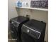 Functional laundry room with modern Samsung front loading washer and dryer at 15951 W Yavapai St, Goodyear, AZ 85338