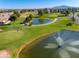 Scenic aerial view of lush golf course with water features, manicured lawns, and beautiful surrounding homes at 1642 E Palm Beach Dr, Chandler, AZ 85249