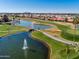 Aerial view of a golf course community showcasing lakes and greenery at 1642 E Palm Beach Dr, Chandler, AZ 85249