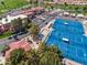 Aerial view of community featuring tennis courts, bocce ball, putting green, pool, and a view of the golf course at 1642 E Palm Beach Dr, Chandler, AZ 85249