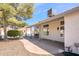 Home's back patio with ample shade and views of the fenced backyard at 1642 E Palm Beach Dr, Chandler, AZ 85249