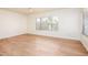 Well-lit bedroom with wood floors and a bright window at 1642 E Palm Beach Dr, Chandler, AZ 85249