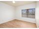 Comfortable bedroom with wood floors, neutral walls and lots of light at 1642 E Palm Beach Dr, Chandler, AZ 85249
