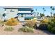 SunBird clubhouse exterior showcases desert landscaping, blue awnings, and contemporary architecture at 1642 E Palm Beach Dr, Chandler, AZ 85249