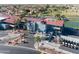 Aerial shot of the community clubhouse, showcasing parking, landscaping, and golf cart storage at 1642 E Palm Beach Dr, Chandler, AZ 85249