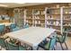 Craft room with ample workspace, featuring shelving with crafting supplies and ample seating at 1642 E Palm Beach Dr, Chandler, AZ 85249