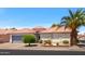 Charming single-story home featuring a tile roof, desert landscaping, and a two-car garage at 1642 E Palm Beach Dr, Chandler, AZ 85249