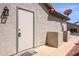 Exterior door, with key pad entry and 'Welcome' mat, plus outside storage units at 1642 E Palm Beach Dr, Chandler, AZ 85249