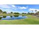 Expansive golf course view, showcasing water features and lush green landscape under a sunny sky at 1642 E Palm Beach Dr, Chandler, AZ 85249