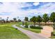 Scenic golf course view, highlighted by lush green landscape, tranquil water features and memorial at 1642 E Palm Beach Dr, Chandler, AZ 85249