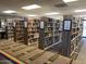 Well-lit library with rows of bookshelves filled with books and decorative carpeting at 1642 E Palm Beach Dr, Chandler, AZ 85249