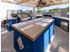 Outdoor grilling area featuring a covered pergola, stainless steel grills and bar with parking in the background at 1642 E Palm Beach Dr, Chandler, AZ 85249