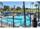 Balcony view of sparkling pool and well maintained grounds featuring golf course, community and palm trees at 1642 E Palm Beach Dr, Chandler, AZ 85249