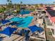 Beautiful pool area with lounge chairs and shaded tables overlooking a serene lake and lush golf course at 1642 E Palm Beach Dr, Chandler, AZ 85249
