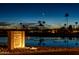 Sunbird Golf Resort welcome sign by the lake, beautifully lit at dusk at 1642 E Palm Beach Dr, Chandler, AZ 85249